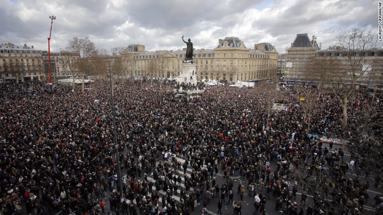 A crowd gather in Republique square before the demonstration, in Paris, France, Sunday, Jan. 11, 2015. A rally of defiance and sorrow, protected by an unparalleled level of security, on Sunday will honor the 17 victims of three days of bloodshed in Paris that left France on alert for more violence. (AP Photo/Laurent Cipriani)
