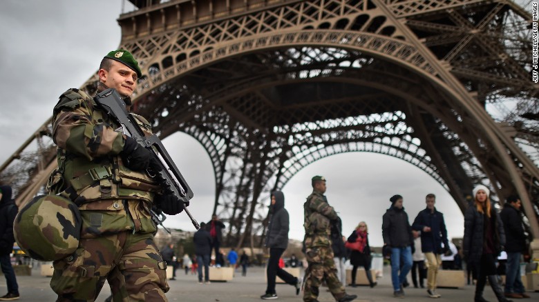PARIS, FRANCE - JANUARY 12: French troops patrol around the Eifel Tower on January 12, 2015 in Paris, France. France is set to deploy 10,000 troops to boost security following last week&#39;s deadly attacks while also mobilizing thousands of police to patrol Jewish schools and synagogues. (Photo by Jeff J Mitchell/Getty Images)