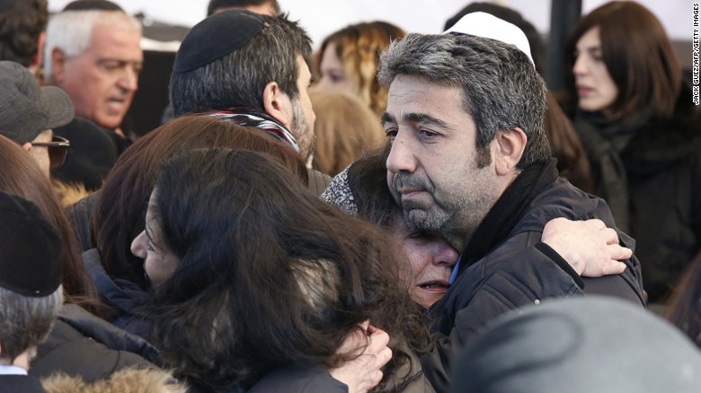 Israeli mourners hug at the funeral in Jerusalem of four French Jews killed in an attack on a kosher supermarket in Paris last week. 