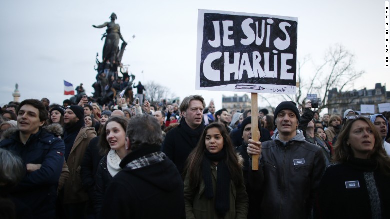 People holding cardboards reading &#39;Je suis Charlie (I am Charlie) take part in a Unity rally Marche Republicaine on the Place de la Nation (Nation Square) in Paris on January 11, 2015 in tribute to the 17 victims of a three-day killing spree by homegrown Islamists. The killings began on January 7 with an assault on the Charlie Hebdo satirical magazine in Paris that saw two brothers massacre 12 people including some of the country&#39;s best-known cartoonists, the killing of a policewoman and the storming of a Jewish supermarket on the eastern fringes of the capital which killed 4 local residents. AFP PHOTO / THOMAS SAMSON (Photo credit should read THOMAS SAMSON/AFP/Getty Images)