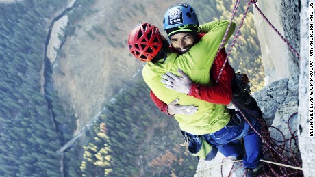 Free climbers Tommy Caldwell, left, and Kevin Jorgeson embrace Wednesday, January 14, after reaching the top of El Capitan, a 3,000-foot rock formation in California&#39;s Yosemite National Park. They are the first to successfully climb El Capitan&#39;s Dawn Wall using only their hands and feet.