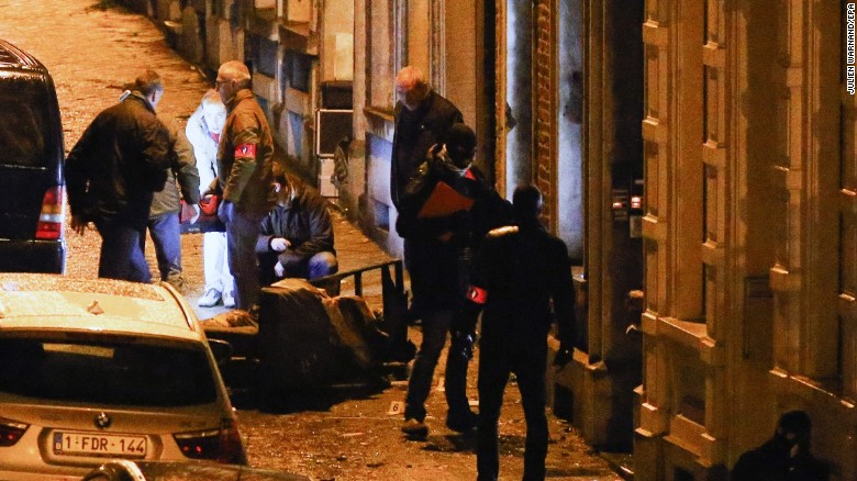 Police officers gather at the scene of an anti-terrorism operation in Verviers, Belgium, on Thursday, January 15. Two people were killed during a raid on a suspected terror cell, Belgian authorities said. A third suspect was injured and taken into custody.