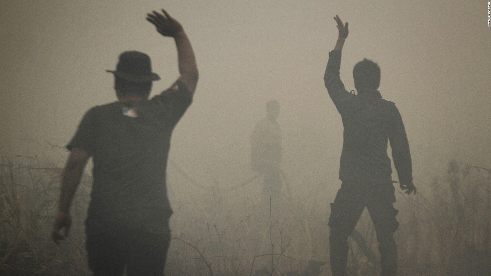 Indonesian firefighters put out a fire on smoldering peatland in Siak Regency located in Riau province on Indonesia's Sumatra island, March 1, 2014.