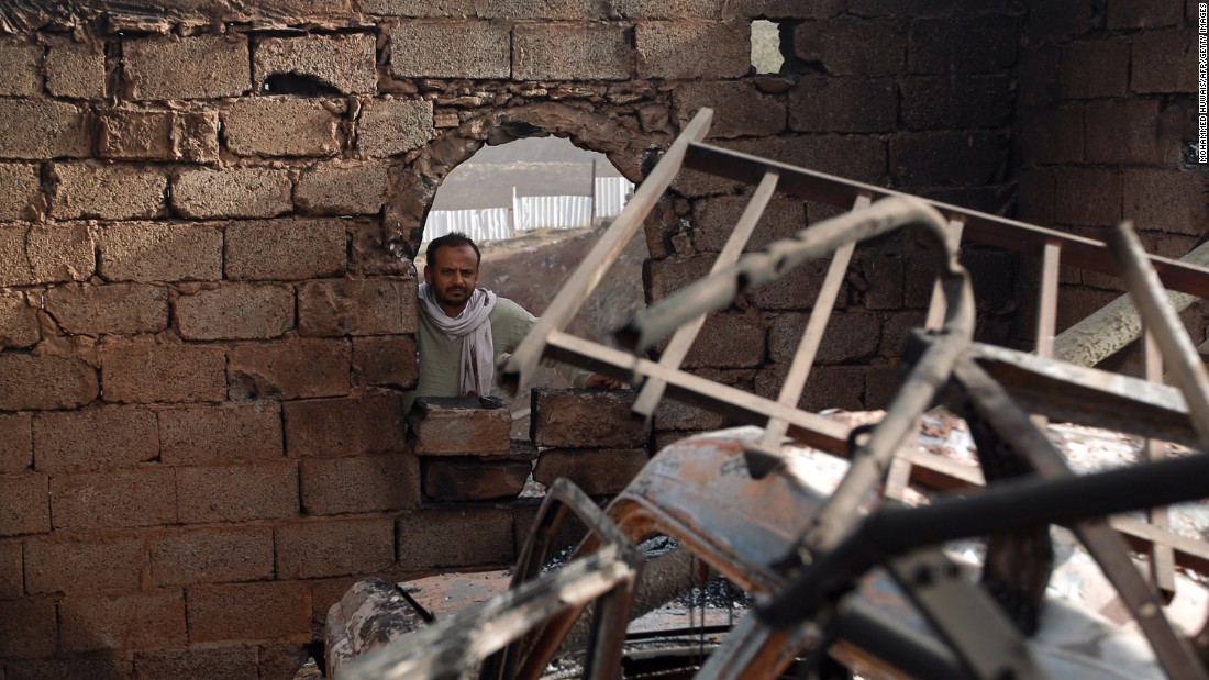 A man surveys his damaged home in Sanaa on January 20.