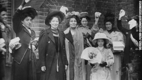 English suffragettes Emmeline Pankhurst (center) and her daughter Christabel Harriette (third from left) are cheered by supporters after their release from prison in 1908. 