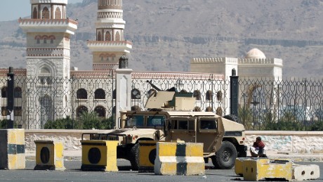 A Houthi militiaman sits near a tank near the presidential palace in Sanaa on Thursday, January 22.