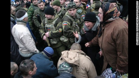 People in downtown Donetsk react as Ukrainian prisoners of war are handed over by pro-Russian rebels on January 22.