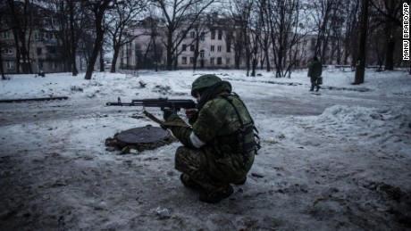 A rebel takes aim while protecting a supply position in the Kievsky district of Donetsk on January 22.