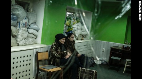 Women sit in a shelter during a battle in Donetsk on Sunday, January 18.