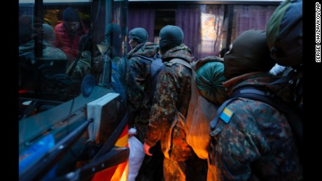 Men from the Azov Volunteer Battalion board a bus in Kiev to join the fight against the rebels on Saturday, January 17.