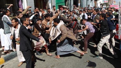 Houthi rebels fight with Yemeni protesters during a rally in Sanaa on January 24. Thousands of Yemenis took to the streets of Sanaa in the largest demonstration against Houthis since the Shiite militiamen overran the capital in September.  
