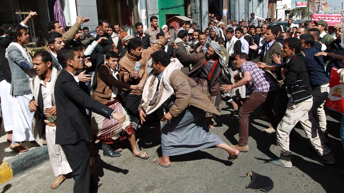 Houthi rebels fight with Yemeni protesters during a rally in Sanaa on January 24. Thousands of Yemenis took to the streets of Sanaa in the largest demonstration against Houthis since the Shiite militiamen overran the capital in September.  