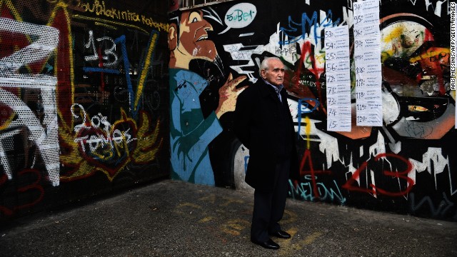 A man arrives at a polling station in Athens on January 25, 2015, as Greece votes in a general election that could bring the anti-austerity Syriza party to power and lead to a renegotiation of the country's international bailout.