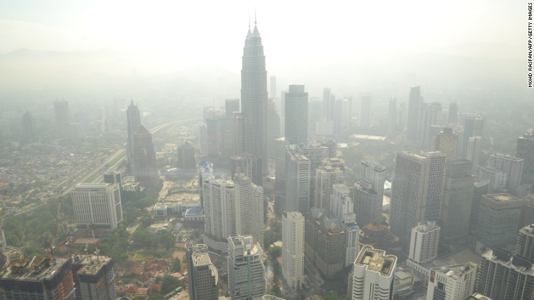 A haze has periodically wafted over Southeast Asia for 20 years. It is especially bad in the Asia-Pacific region, which has a population of over 4.2 billion and high population density. Pictured, smog hovers above the Kuala Lumpur skyline in June 2013. 