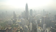 A haze has periodically wafted over Southeast Asia for 20 years. It is especially bad in the Asia-Pacific region, which has a population of over 4.2 billion and high population density. Pictured, smog hovers above the Kuala Lumpur skyline in June 2013.