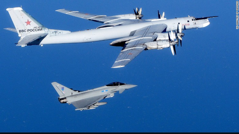 A Russian Tu-95 Bear bomber is escorted by a British Royal Air Force Typhoon fighter during an intercept in September 2014. Click through the gallery to see other intercepts in late 2014.