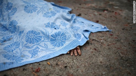 The body of a civilian killed during shelling lies on the ground in Donetsk on Friday, January 30.