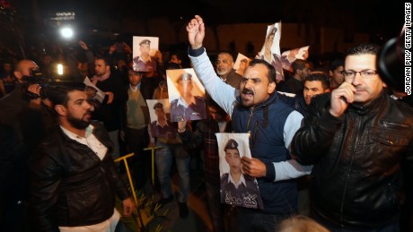 Angry relatives of al-Kasasbeh protest at the entrance to Jordan's royal palace in Amman on Wednesday, January 28.