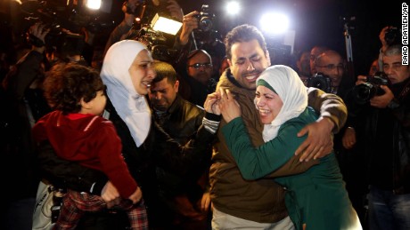 A man comforts al-Kasasbeh's wife during the protest in front of the royal palace on January 28.
