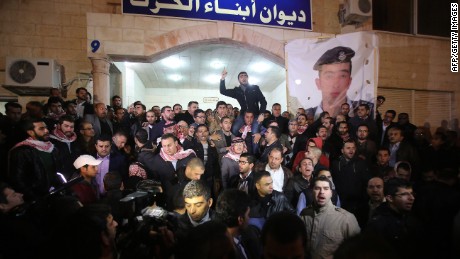 Supporters and family members of al-Kasasbeh gather in Amman after reports of his death on February 3. 