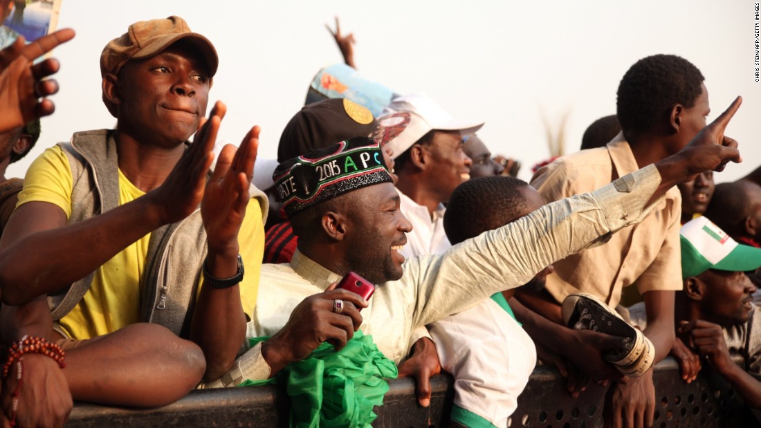 A becapped APC supporter attends a rally in Kuduna on January 19.