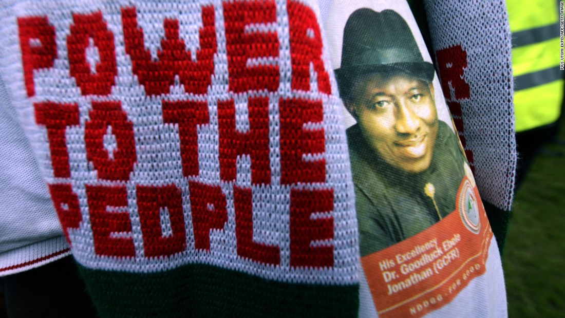 A PDP supporter dons knitwear and a shirt emblazoned with incumbent Goodluck Jonathan's face at a rally on January 28.