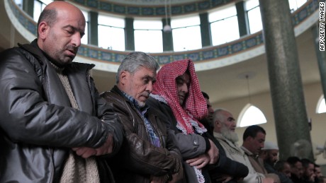 People in Amman pray for al-Kasasbeh on Wednesday, February 4.