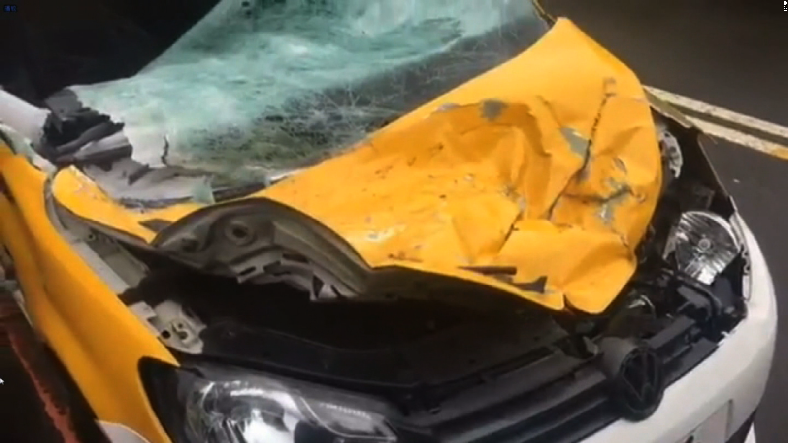 A taxi was hit by the plane as it clipped an elevated highway.