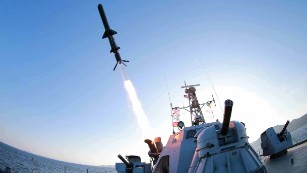 North Korea test-fired a new &quot;ultra-precision&quot; intelligent rocket to be deployed across its navy, the state-run Korean Central News Agency said on February 7, 2015.