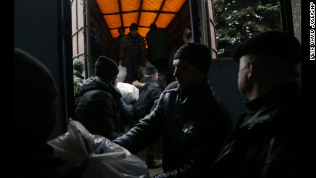 Residents unload humanitarian aid in Debaltseve on Friday, February 6.