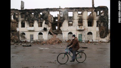 A man rides a bicycle in Vuhlehirsk, Ukraine, on February 6.