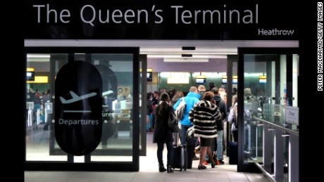 LONDON, ENGLAND - DECEMBER 12:  Passengers line up inside the entrance to Terminal Three as they wait for delayed flights at Heathrow Airport on December 12, 2014 in London, England. Computer problems at the National Air Traffic service have caused severe problems for air passengers at London's airports.  (Photo by Peter Macdiarmid/Getty Images)