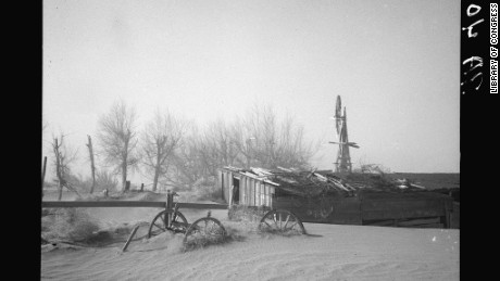 The Dust Bowl drought in the 1930s: Dust blows up dunes at Oklahoma farm.