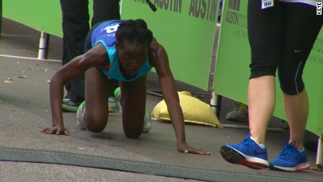 Marathon runner collapses, shocks crowd by doing this - CNN Video