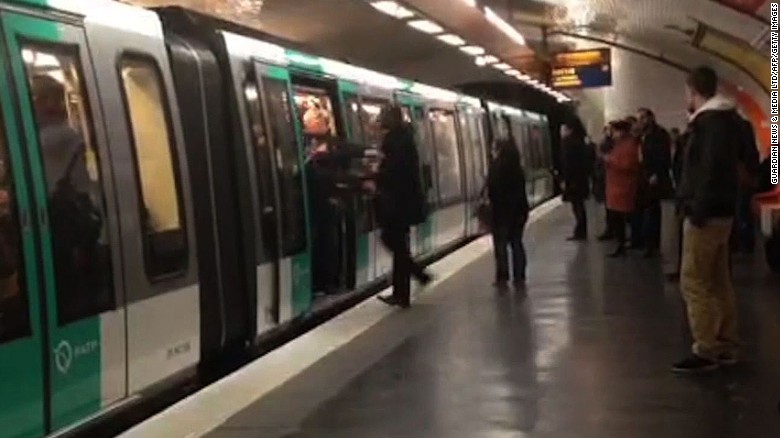 A video grab shows soccer fans pushing to keep a passenger from boarding a Paris Métro train in February.