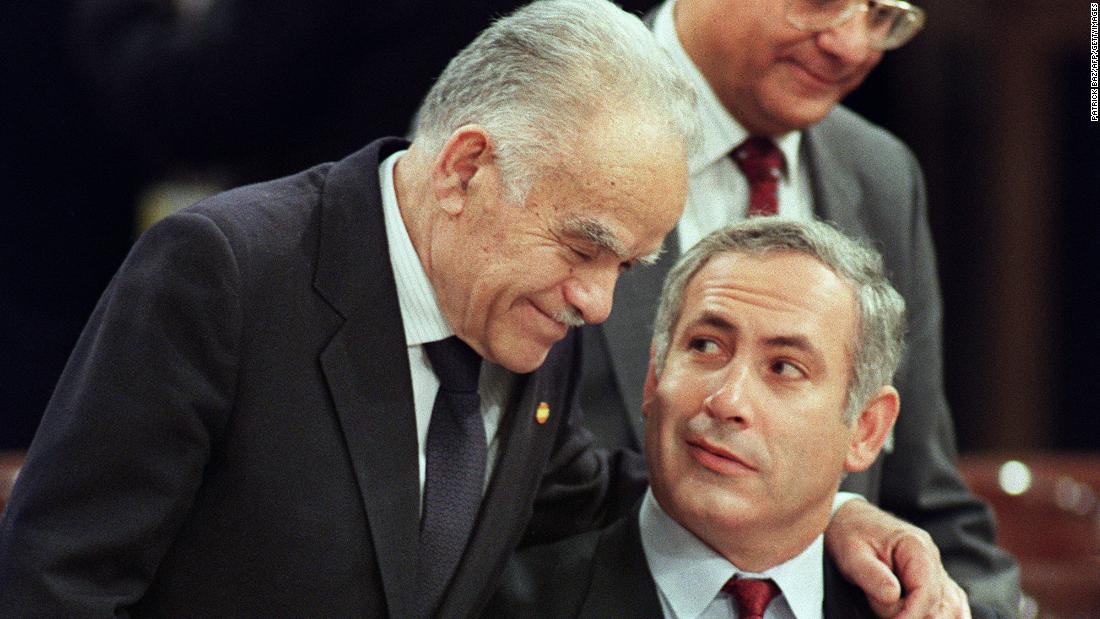 Shamir speaks with Netanyahu at a Middle East peace conference in Madrid in October 1991.