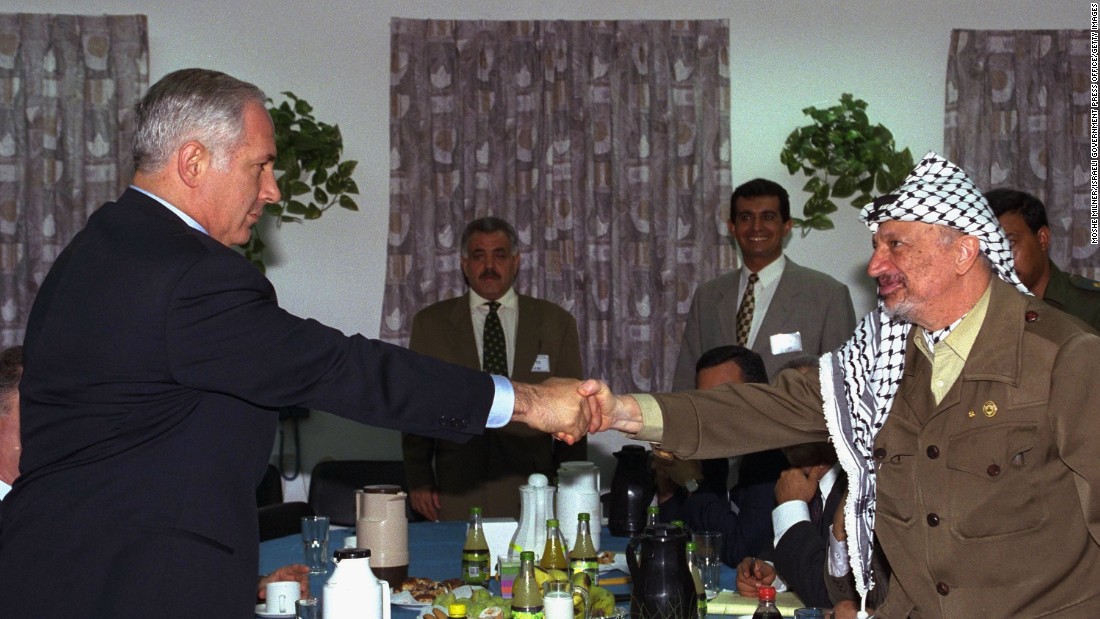 Netanyahu meets with Palestinian leader Yasser Arafat for the first time on September 4, 1996, at an Israeli army base at the Erez Checkpoint in Gaza.