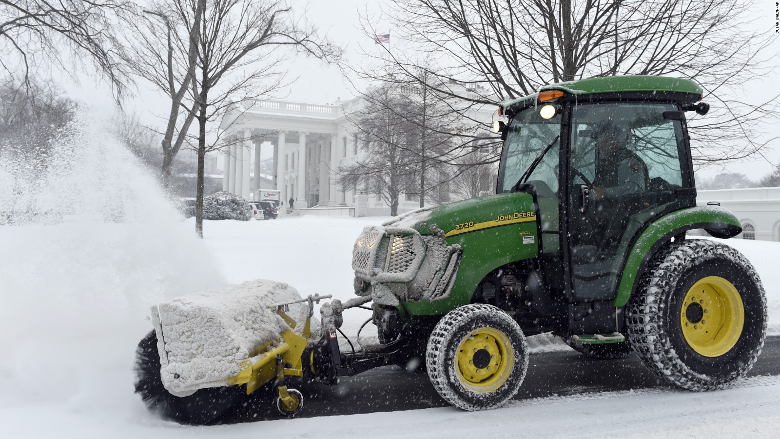 Snow is cleared on the North side of the White House in Washington, Saturday, February 21.