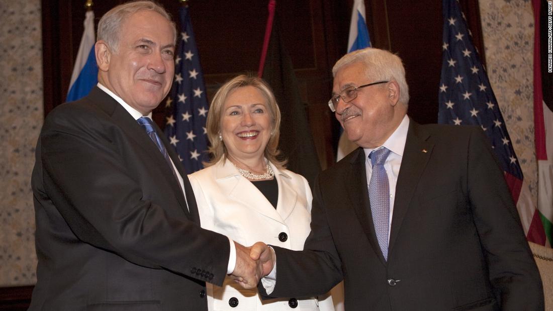 U.S. Secretary of State Hillary Clinton looks on as Abbas and Netanyahu shake hands in Sharm El-Sheikh, Egypt, on September 14, 2010, during a second round of Middle East peace talks.
