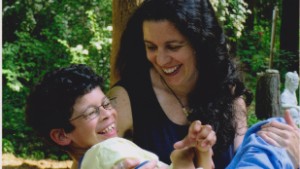 Carrie McGee and her son, Alex. When Alex was diagnosed with Williams syndrome, she quit her job to care for him. 