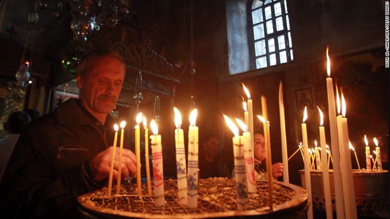 Christians light candles last month in the Church of the Nativity in the West Bank town of Bethlehem, the birthplace of Jesus.