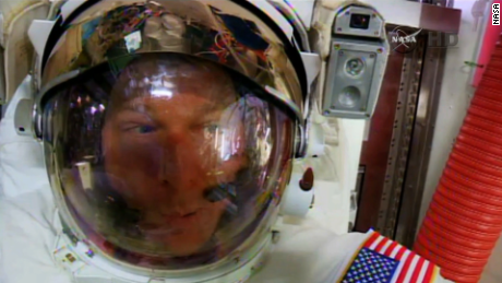 Astronauts finish 5-hour spacewalk despite water found in helmet
