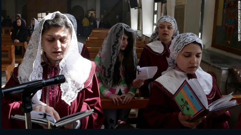 Displaced Assyrian women who fled their homes due to ISIS attacks pray at a church on the outskirts of Damascus, Syria, on Sunday, March 1. ISIS militants recently abducted at least 220 Assyrians in Syria. 