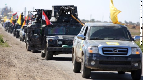 Members of the Iraqi security forces leave Samarra, Iraq  north of Baghdad, as they drive towards  Tikrit, to launch an assault against the ISIS on February 28. 