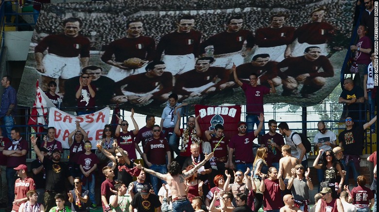 Supporters of Torino FC hold a banner commemorating the players who lost their lives when their plane crashed in the Superga air disaster, on the 65th anniversary of the tragedy last May.