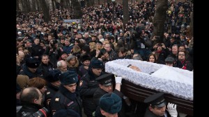 People follow the coffin of Russian opposition leader Boris Nemtsov during a farewell ceremony in Moscow on Tuesday, March 3. Nemtsov, a vocal opponent of Russian President Vladimir Putin&#39;s, was gunned down hundreds of feet away from the Kremlin on Friday, February 27. The assassination has spawned a flood of conspiracy theories; many suspect the Kremlin of either direct or indirect involvement. Putin condemned the killing and ordered three law enforcement agencies to investigate, the Kremlin said.