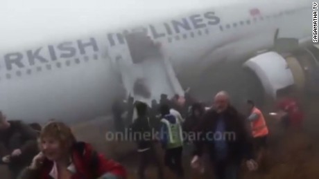 Delta flight skids off LaGuardia runway, stops feet from frigid.