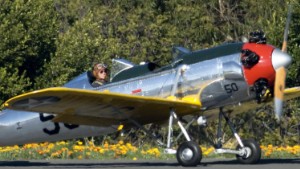 Actor Harrison Ford flies a Ryan PT-22 military plane on January 28, 2011, in Santa Monica, California. This is believed to be the same plane Ford, an experienced pilot, was flying when he crashed Thursday, March 5, on a golf course. The World War II-era plane is also known as the Ryan ST3KR.