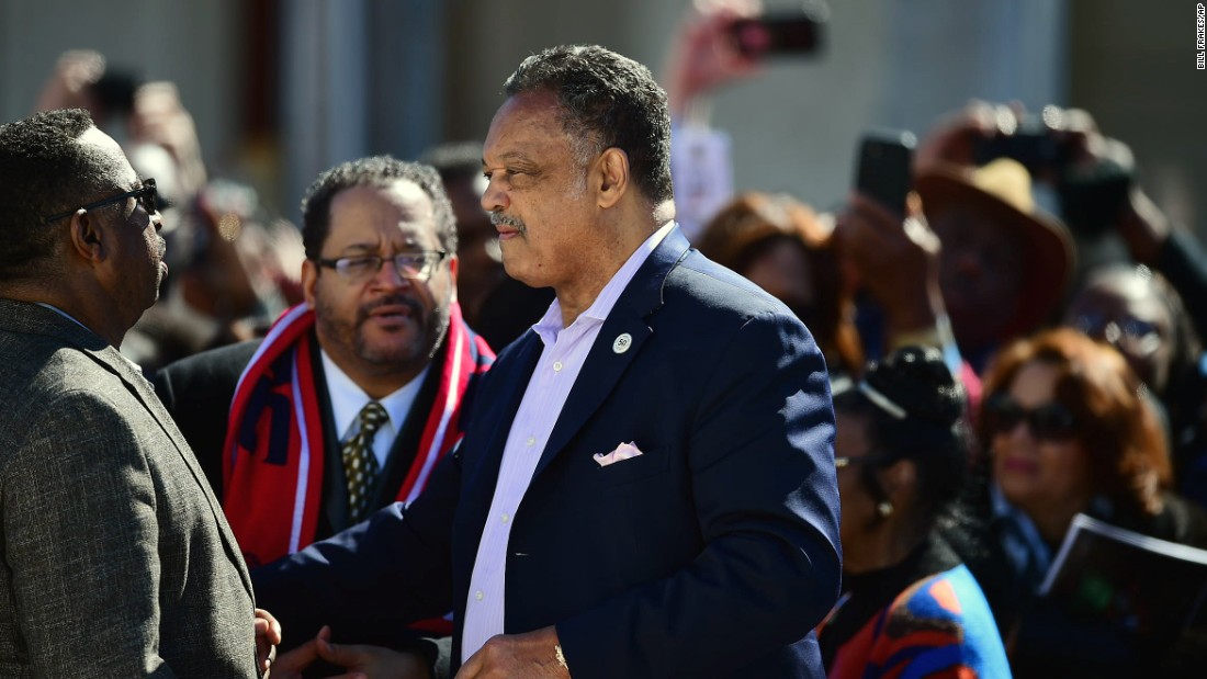 The Rev. Jesse Jackson speaks with people ahead of the event.