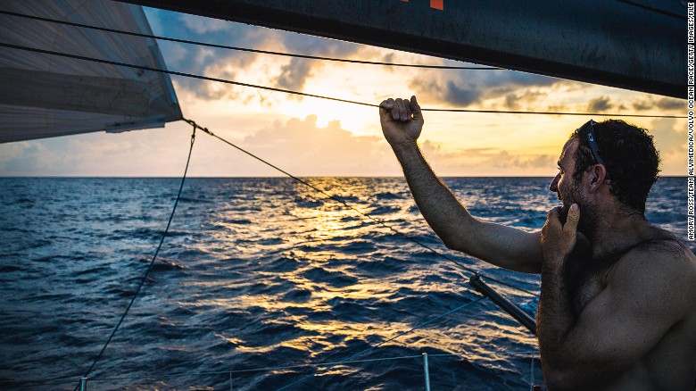 Sailor Seb Marsset looks across the ocean. Over the equator and into the Southern Hemisphere, the weather turns tropical, with rainclouds driving much of the day&#39;s movement south towards Vanuatu.